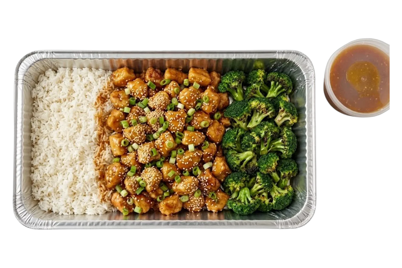 a catering tray of golden orange chicken with broccoli and rice