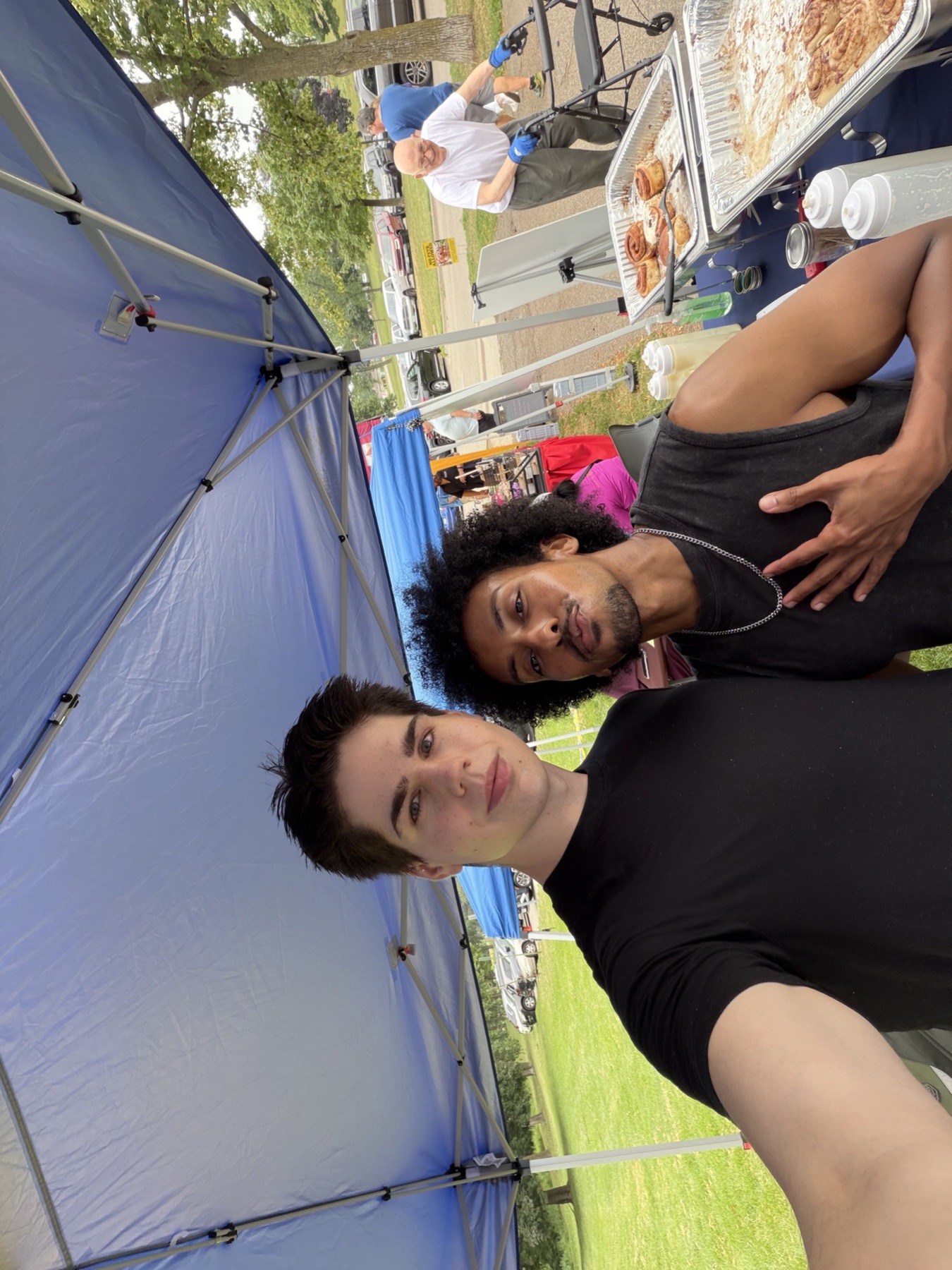 tommy and omar together under the tandoco tent at the farmers market